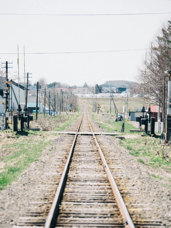 a view of a train track from between the tracks