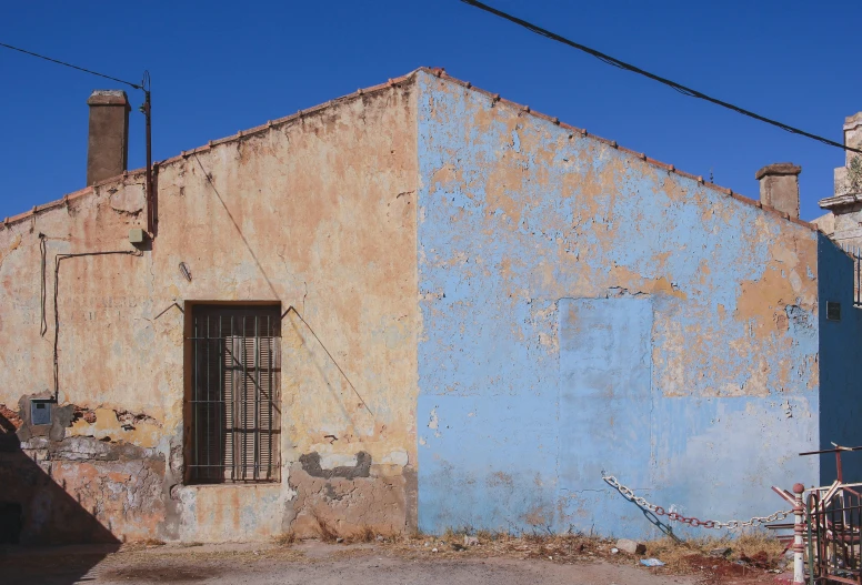 a very old building with a broken down side