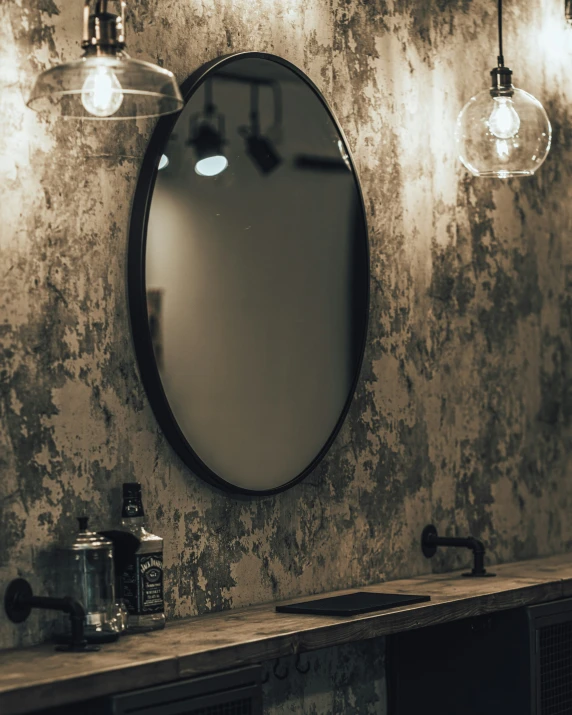 a bathroom with a large mirror sitting next to two sinks
