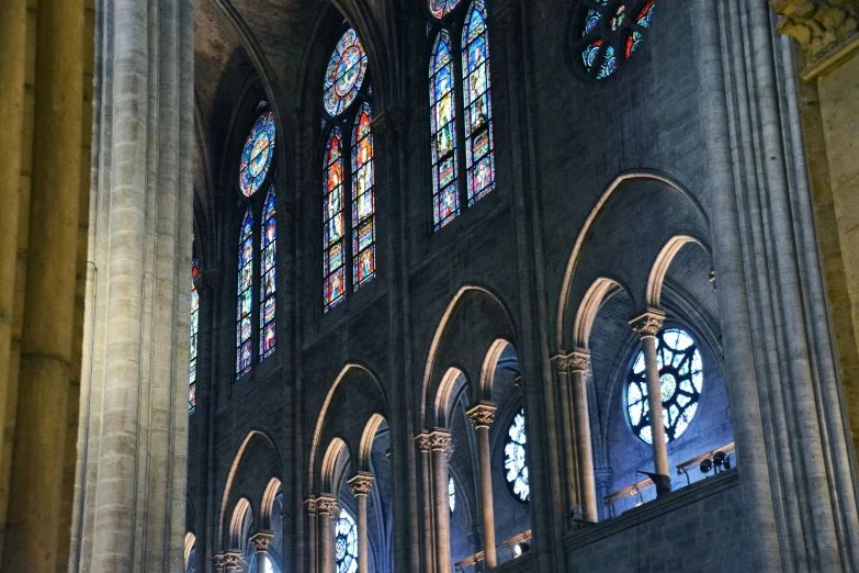 a group of windows are shown in the interior of this church