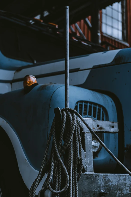 closeup of large rope near an old bus