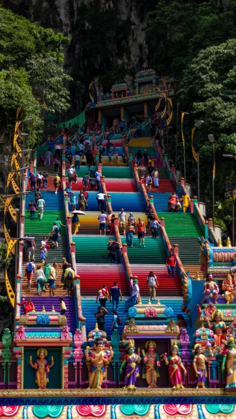 a large group of colorful stairs in the woods