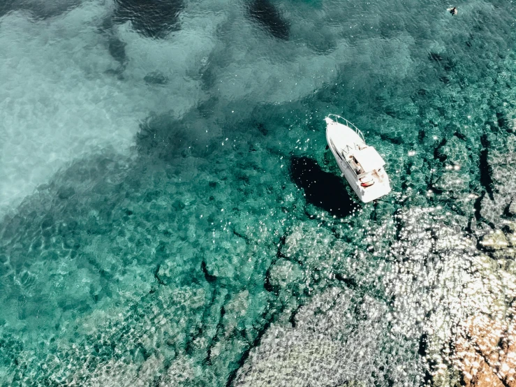 a white boat on a body of water