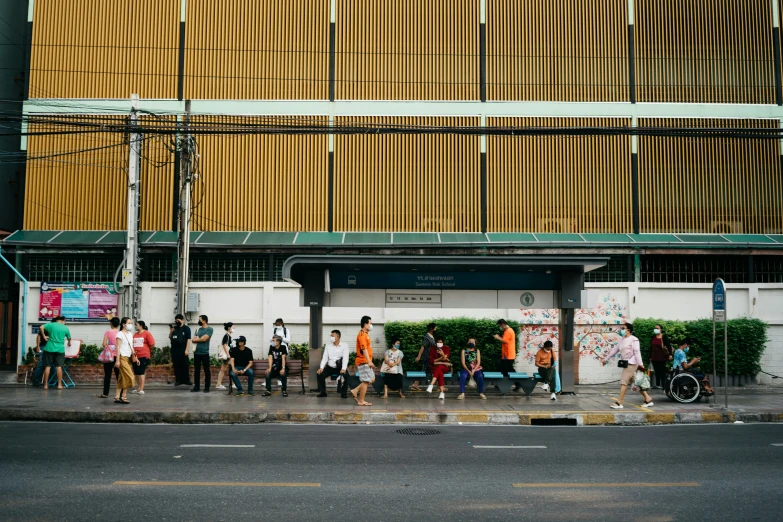 a group of people standing in front of a building