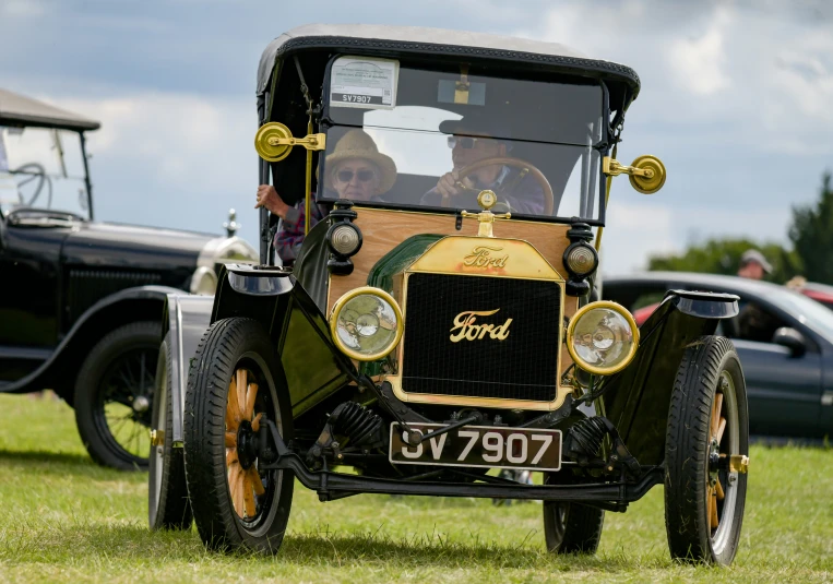 an old fashioned car is on display at the antique car show