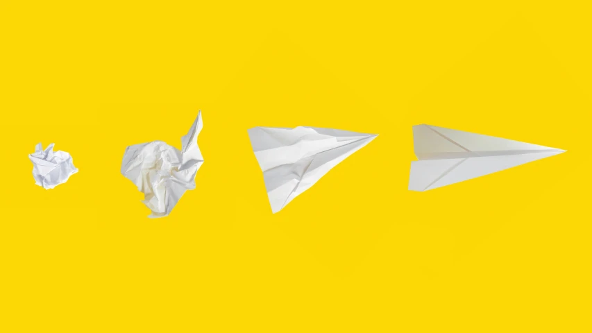 a group of paper planes sitting next to each other