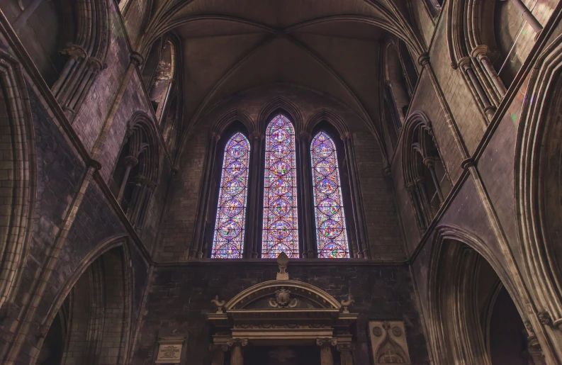 view of an altar with several large windows