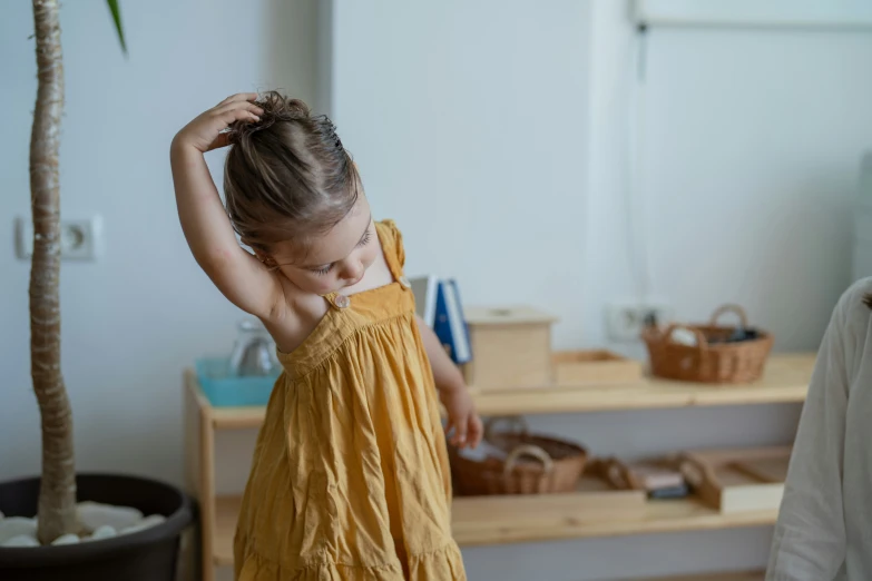 a little girl that is standing up in a room