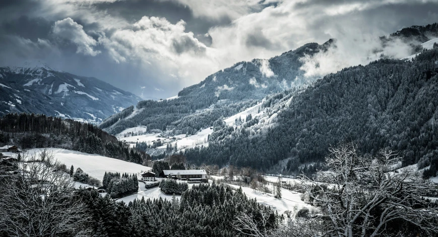 mountain scenery in winter and cloudy skies