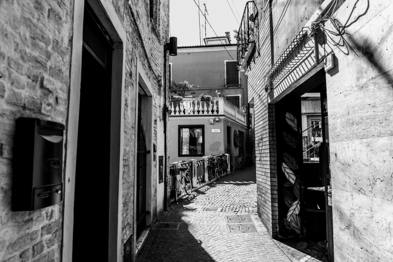 a black and white po of a narrow street in old town