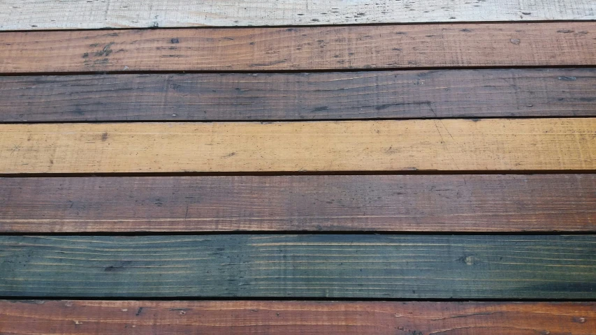 colored wooden boards arranged in a vertical horizontal row