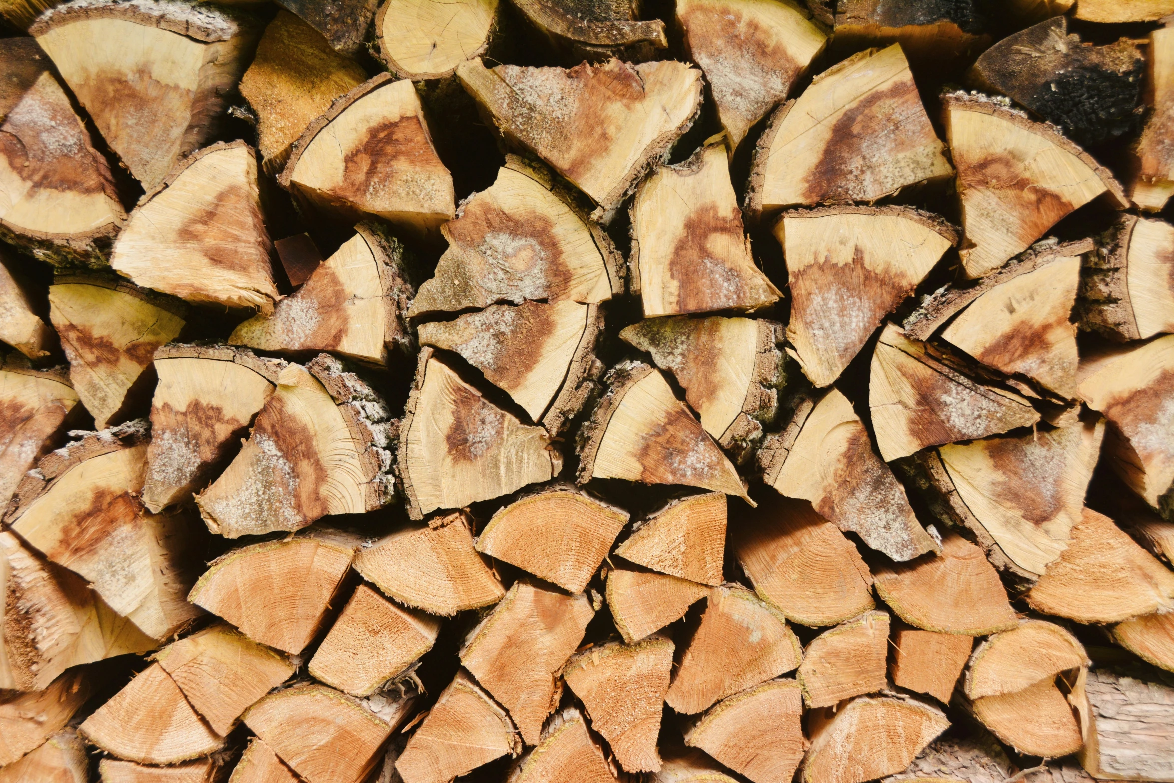 several pieces of cut wood stacked up on each other