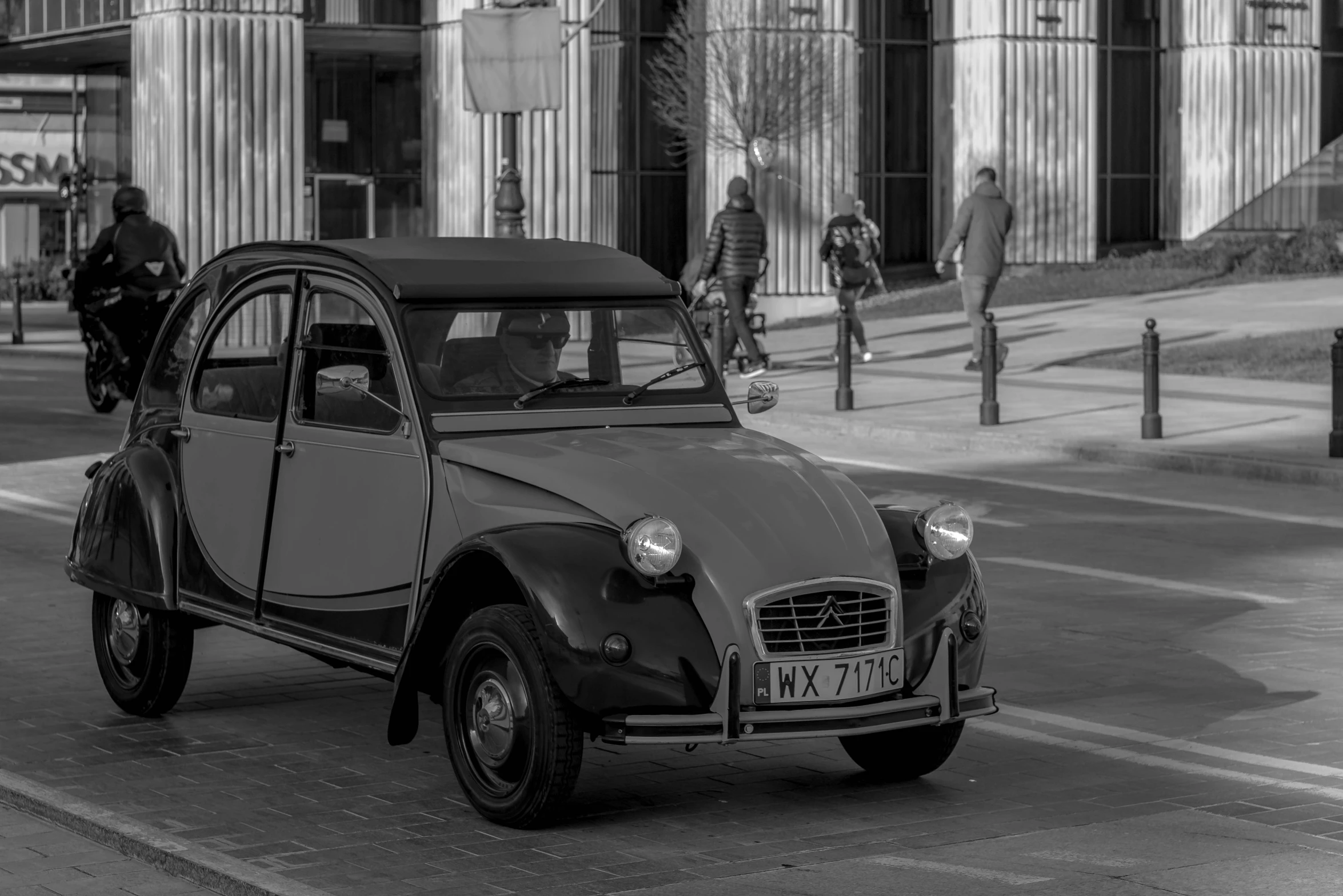 an old fashion car sitting parked in the street