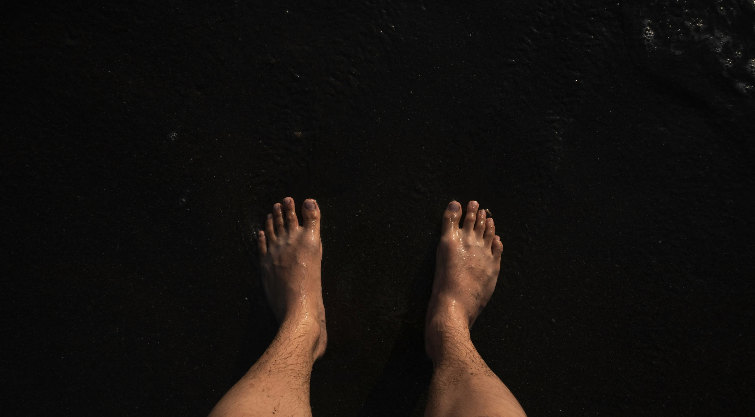 the top view of a person's feet and legs