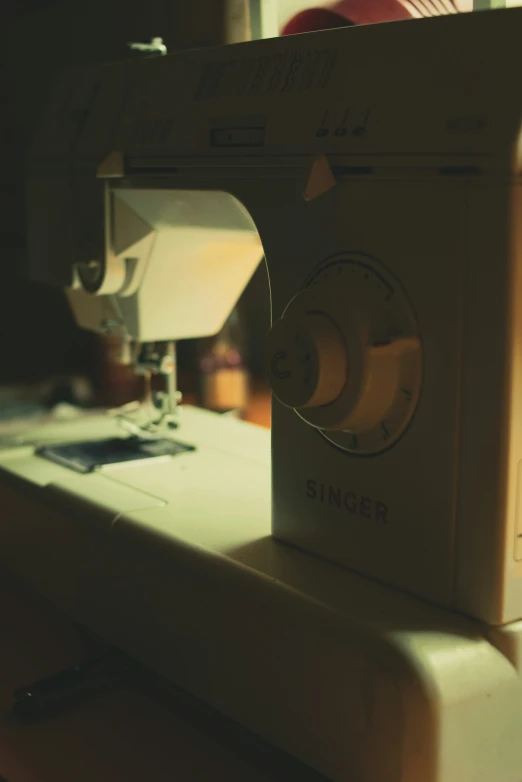 the sewing machine is being used on the table