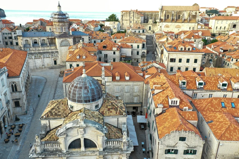 an overhead view of a city with old buildings and large domes