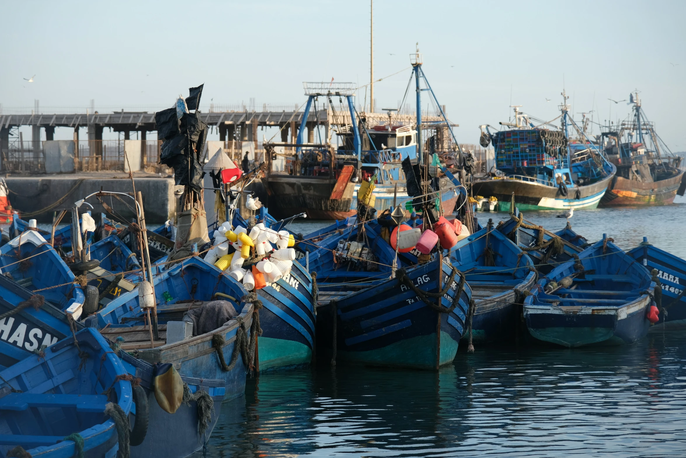 there are many boats lined up at the pier