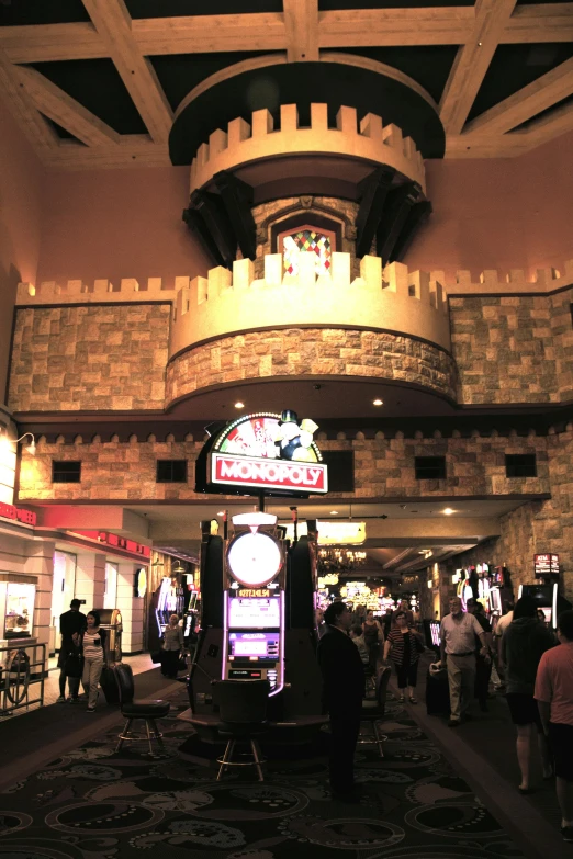 an arcade is empty during the day with people milling around