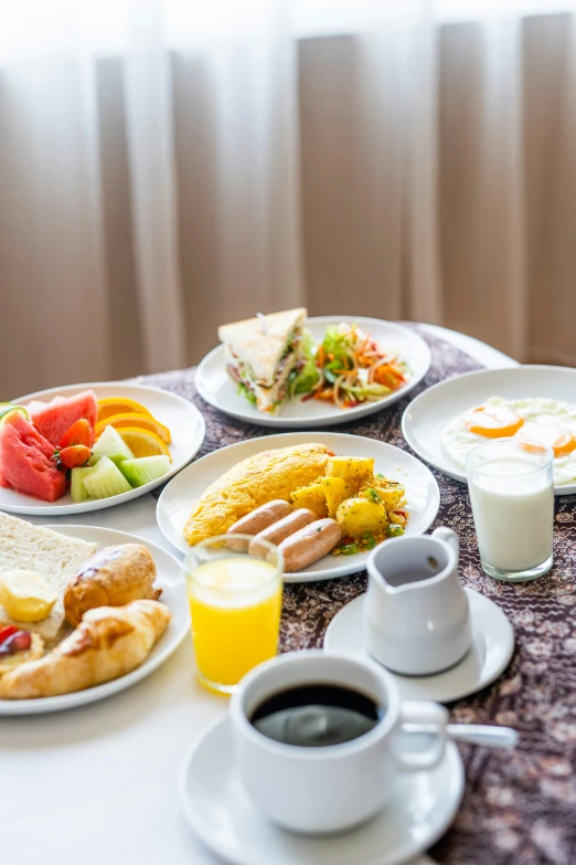 the table is covered with several different kinds of food