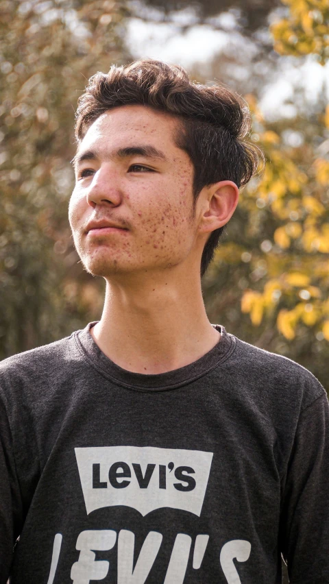 a man poses for a pograph on a cold day