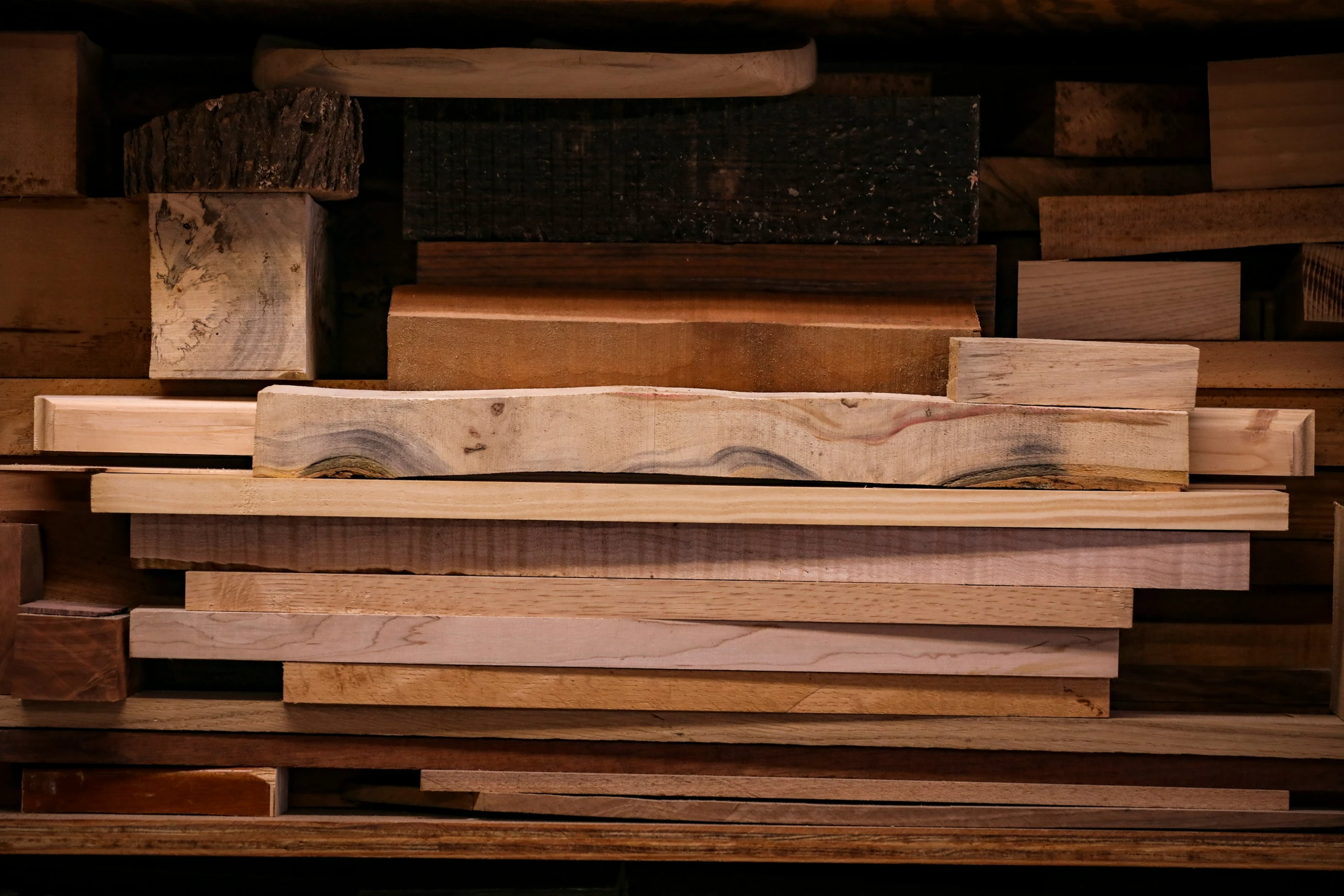 a pile of wooden lumber with several blocks on top