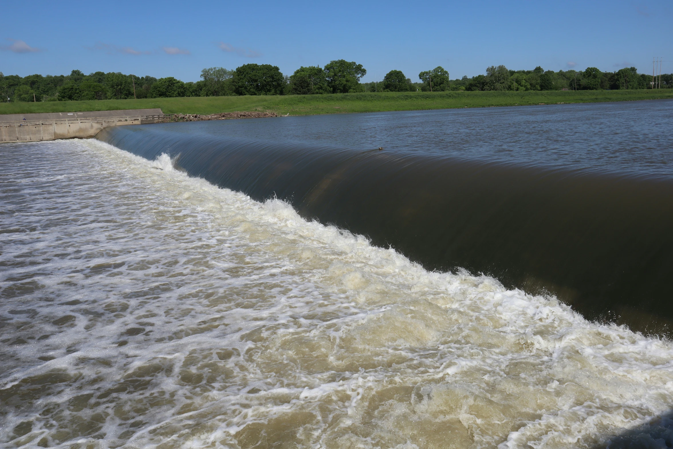 a jet boat is in the river, making the water flow