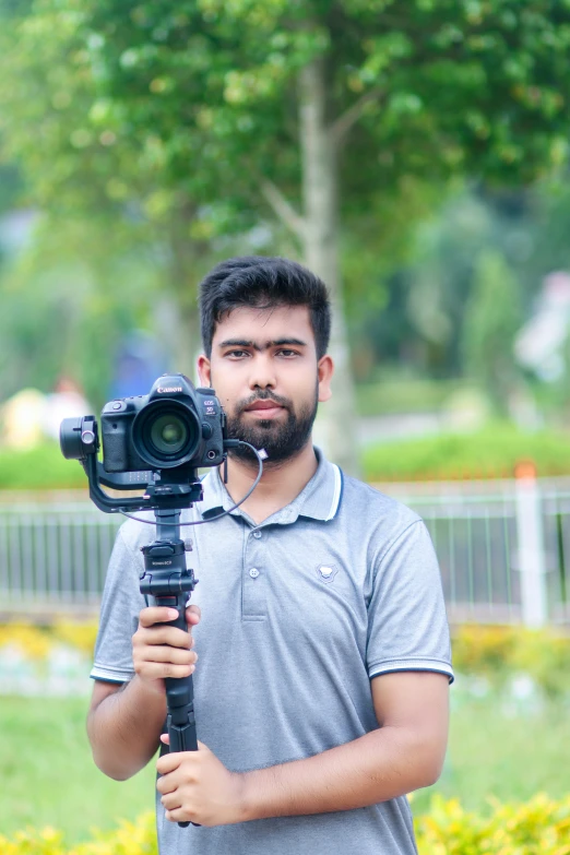 the pographer is taking a picture on his tripod