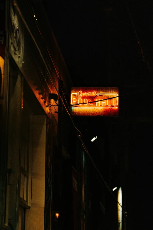 a night time view of a business sign outside at night