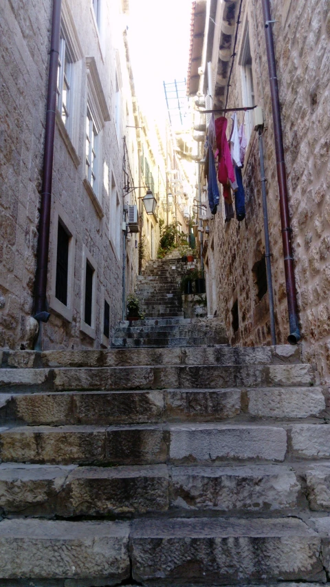 an image of stairs going down to some buildings