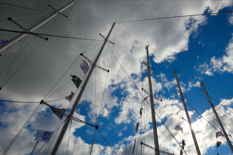 the masts and rig lines of a boat on a sunny day