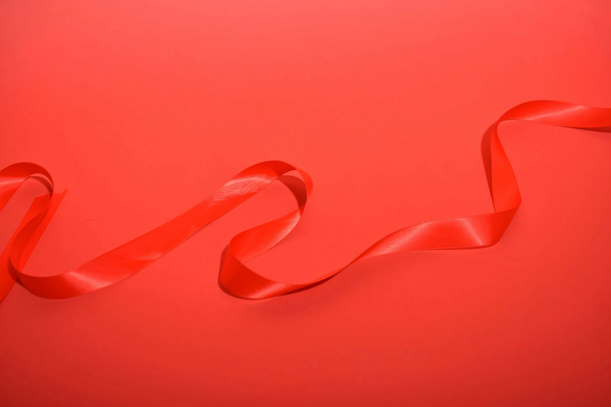a red ribbon that has been curled up