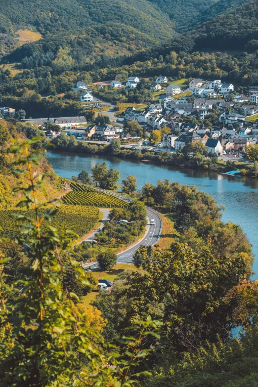 a city and river in the middle of some mountains