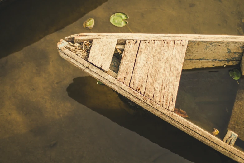 wooden structure partially submerged on top of water