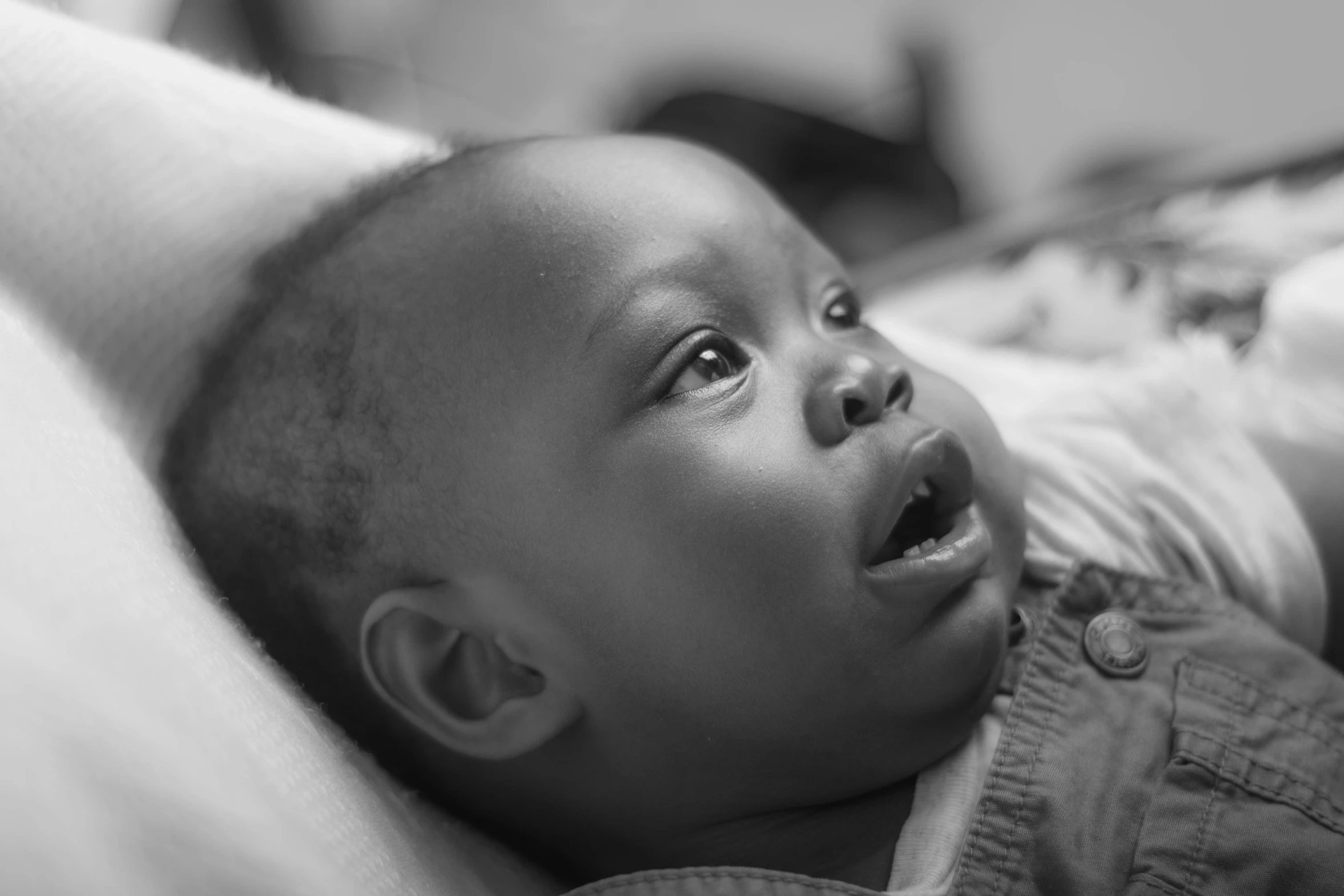 a young child is laying down on the bed