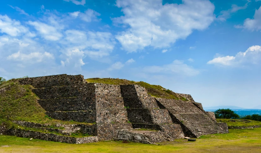 two large pyramids are situated near each other on the hill