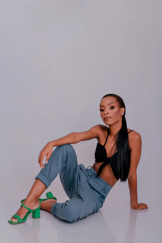 a young woman is posing in the studio