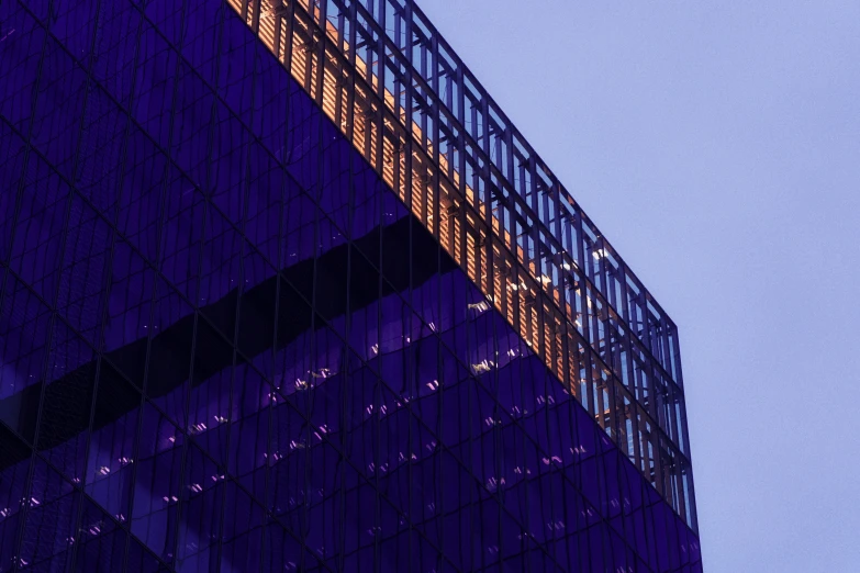 a blue and yellow building with people on it