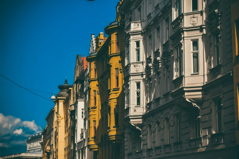 several building with ornate design against a blue sky