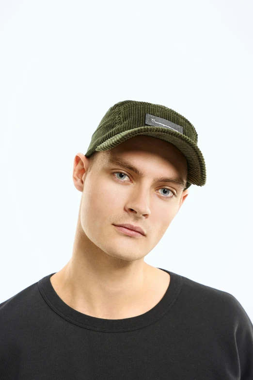 a man wearing a hat and a black shirt