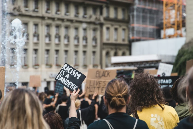 a protest is being held outside on a city street