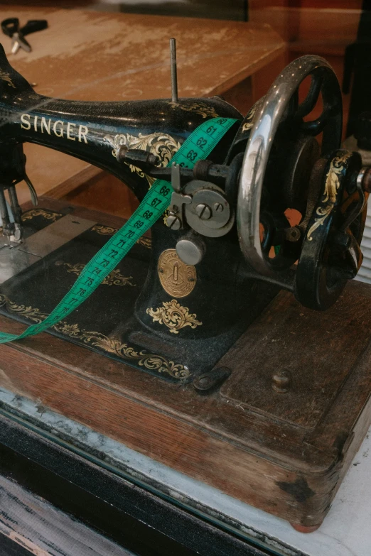 an old sewing machine that is sitting on top of a table