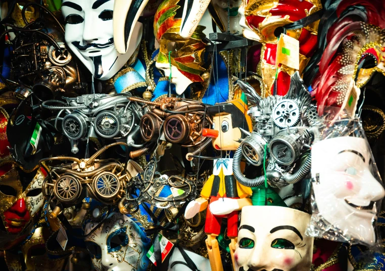 colorful mask and costume items displayed in a market