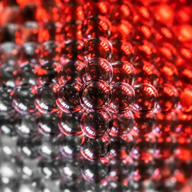 red and black spheres in the middle of each other