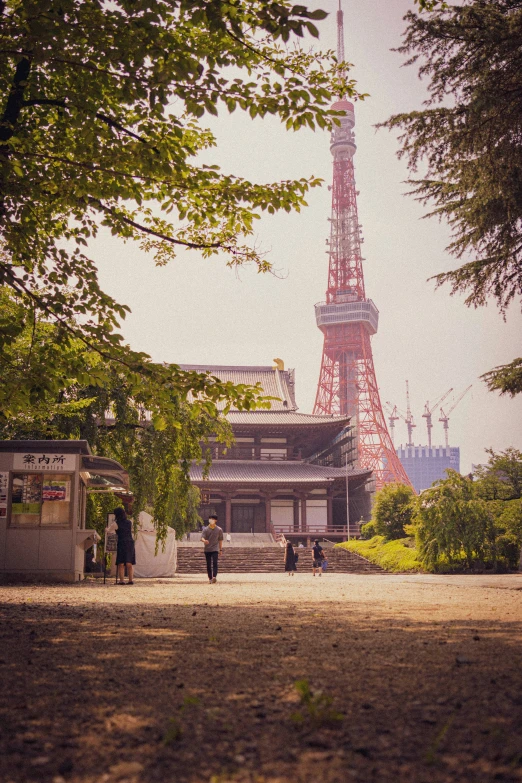 an image of a couple walking by the eiffel tower