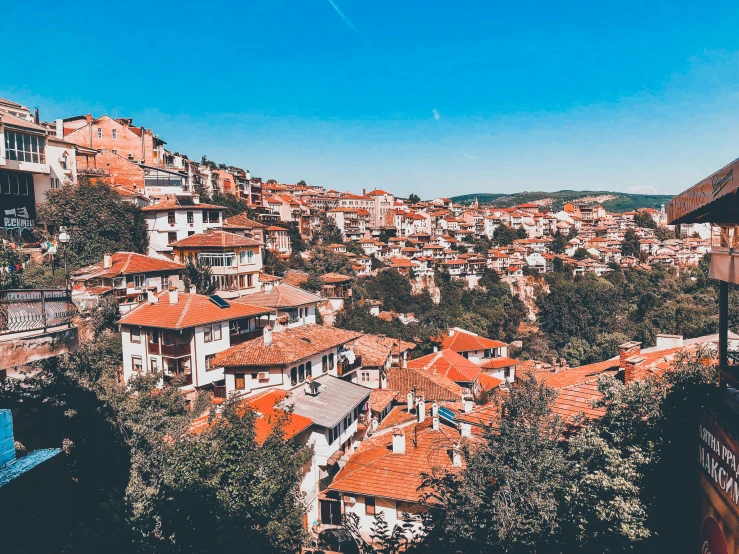 rooftops on a hillside with red roofs on top of houses