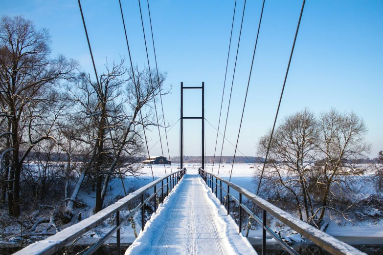 an electric wire line is above a bridge