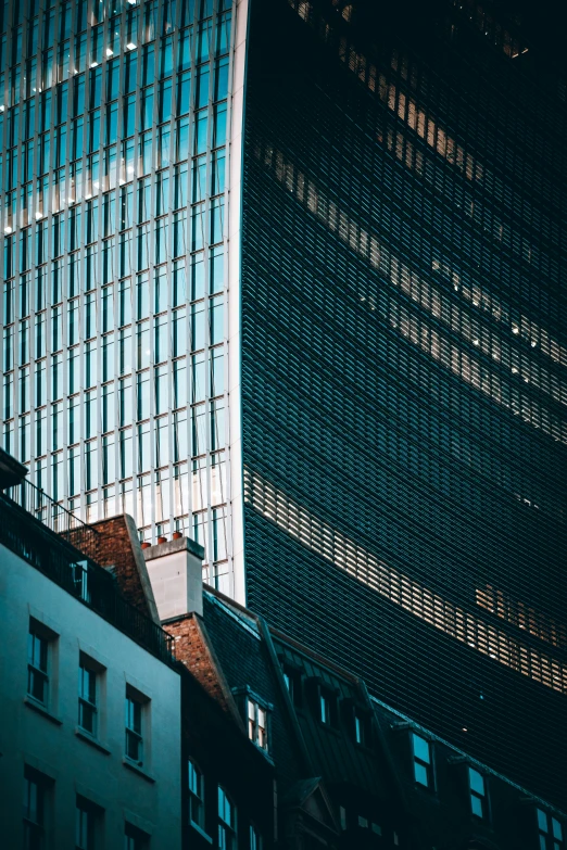 a view of the glass building and its surrounding spire