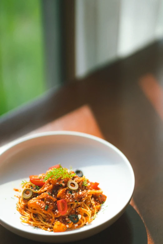 a white bowl with food on a table