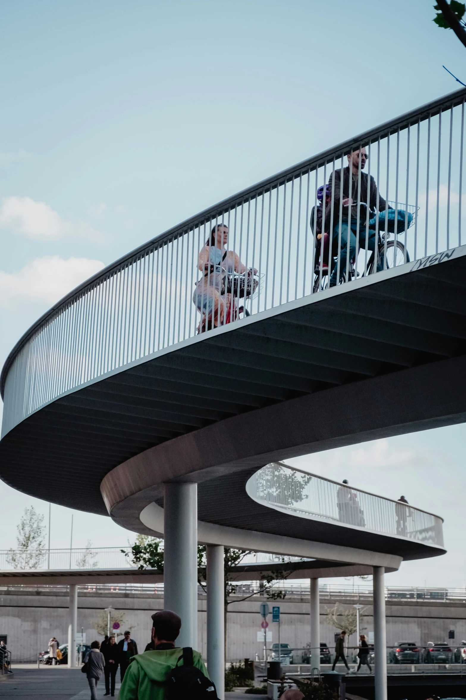 some people and two walking around an overpass