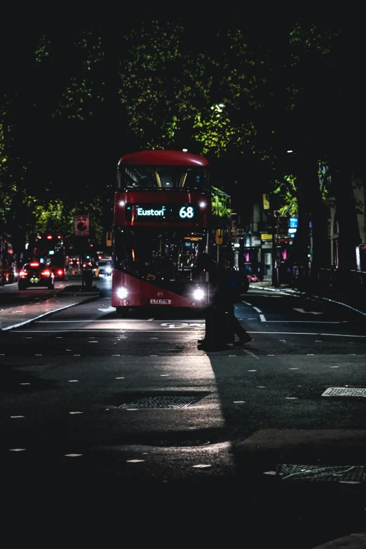 an image of a red bus going down the street